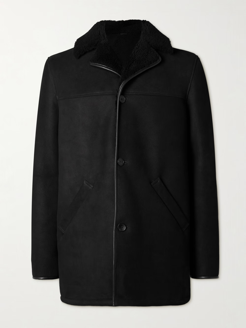 Men’s black suede leather winter coat with shearling collar, button-front closure, and angled side pockets on a light background.